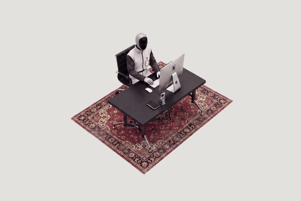 HOWARD working at his desk
